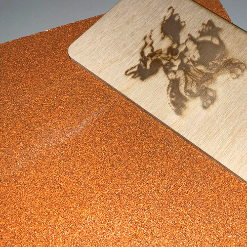 Sanding the edges of the second phone stand so I don't get splinters.