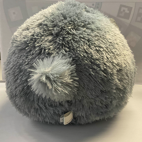 Back angle of the cat plushie. This object means a lot to me because it was the first thing my mom bought for me from my very first gaming convention in Toronto when I was 12. 